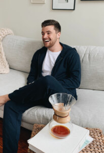 Cropped version of the same photo, man on the couch