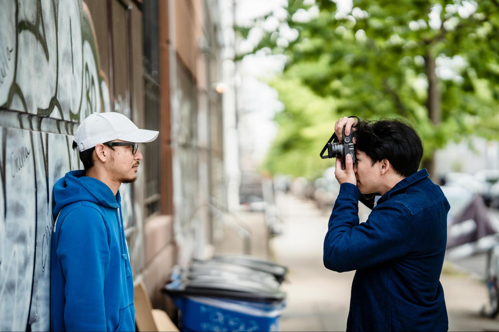 dating app photographer taking photo of client on the street
