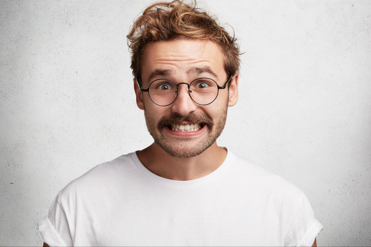 wide smile with glasses man