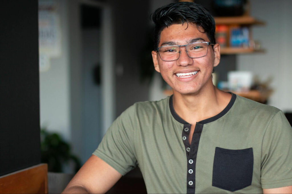 smiling man in green shirt, professional