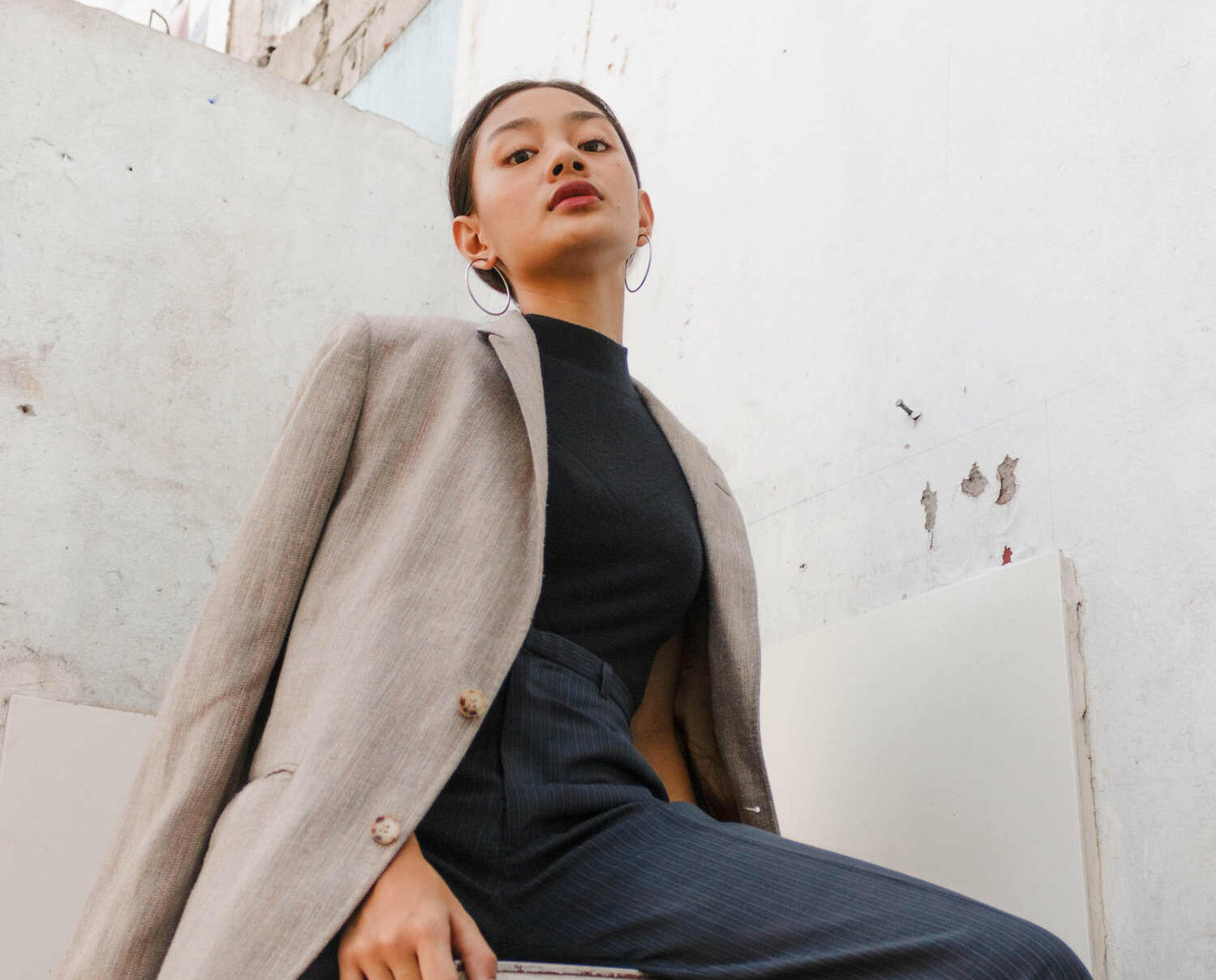 women posing in powerful position with business attire