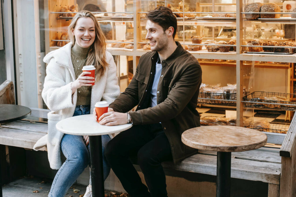 two people talking at a coffee shop