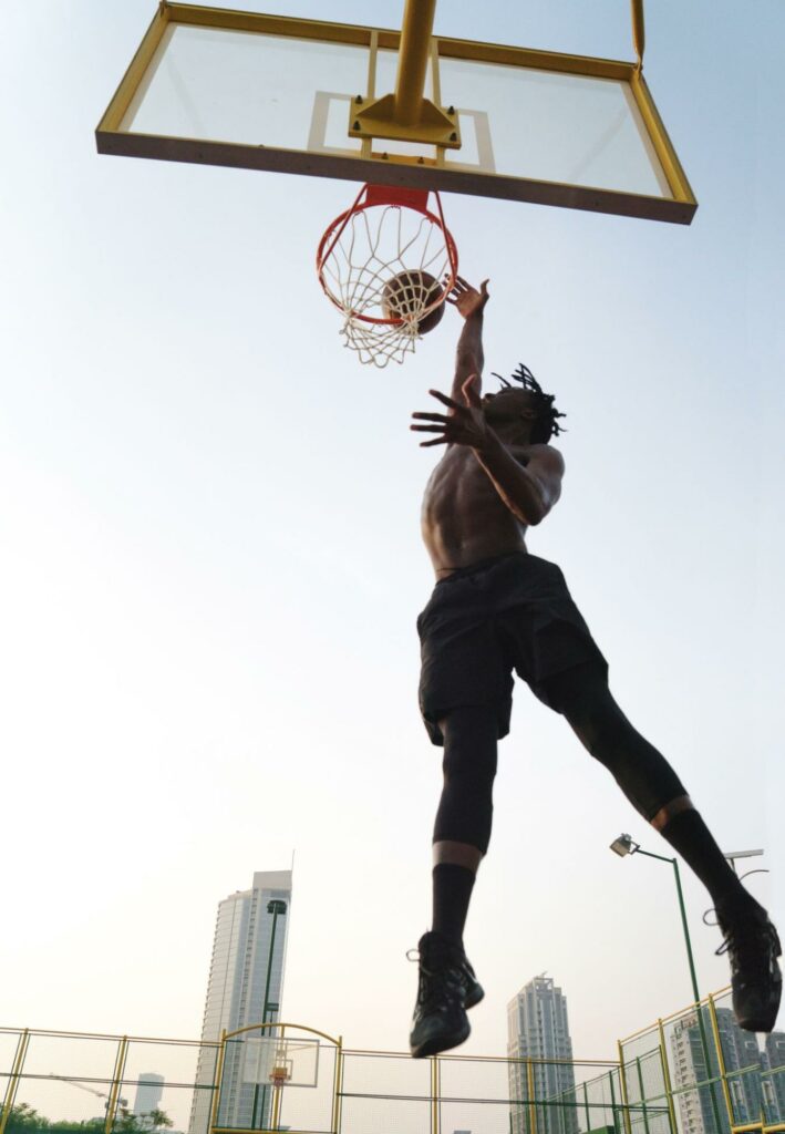 man dunking a basketball, super tall