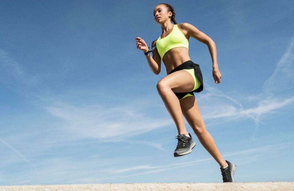 woman exercising, tall, shot from below photo