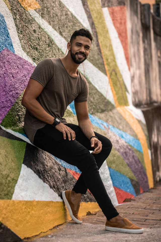 man leaning against wall, online dating profile photo