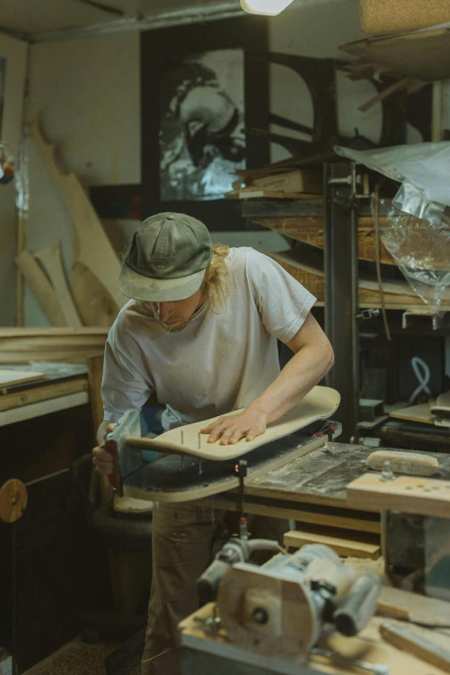 man polishing skateboard, online dating hobby photo example