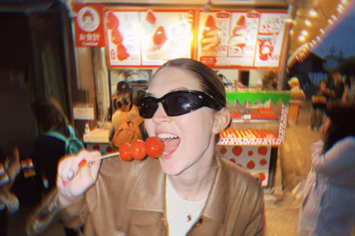 Girl eating candy at a fair