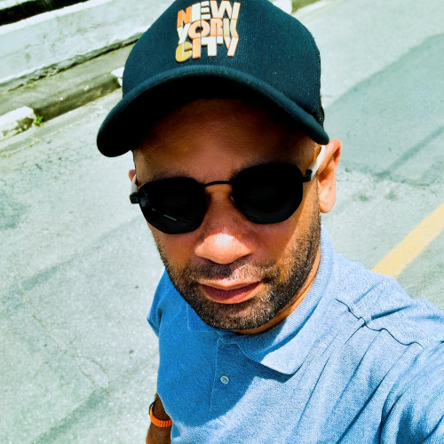 man taking a selfie with a hat