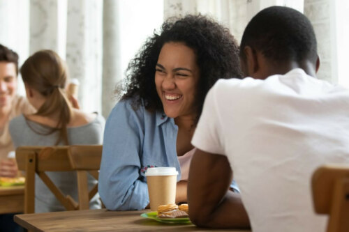 couple laughing at a speed dating event, speed dating in person event