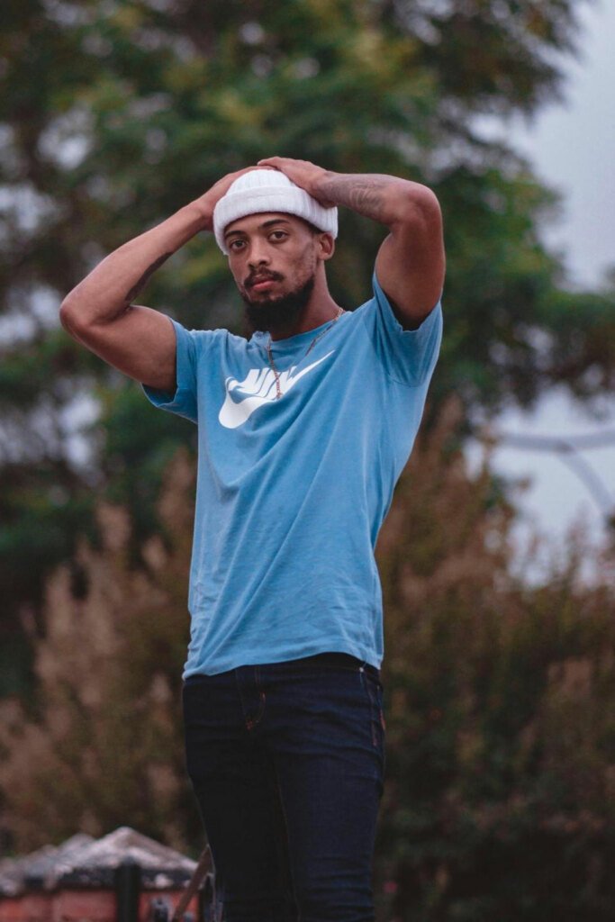 man posing in natural light, great full body photo for dating app