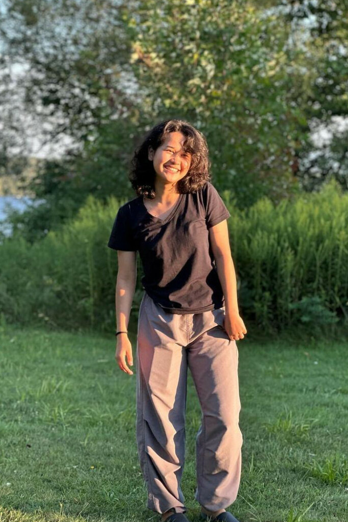 woman smiling in natural light, great full body photo for dating app