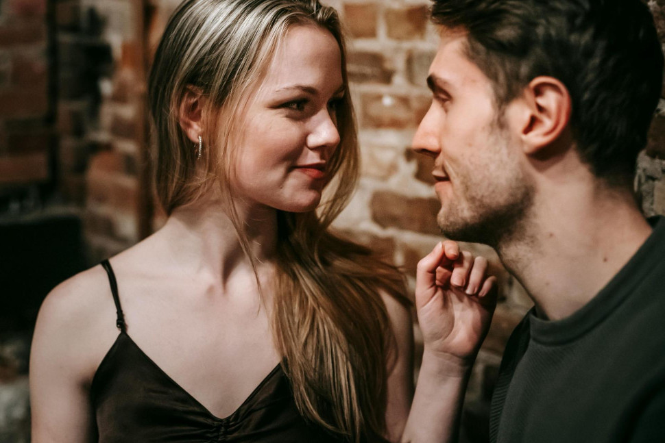 couple flirting in a bar