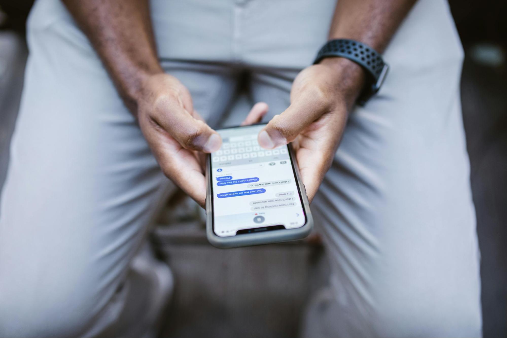man texting on his phone