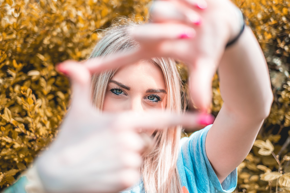 woman framing the photo with her hands