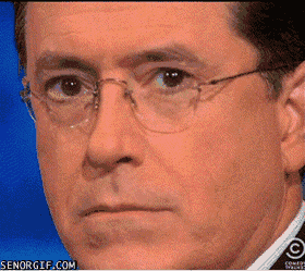awkward smiling, stephen colbert gif